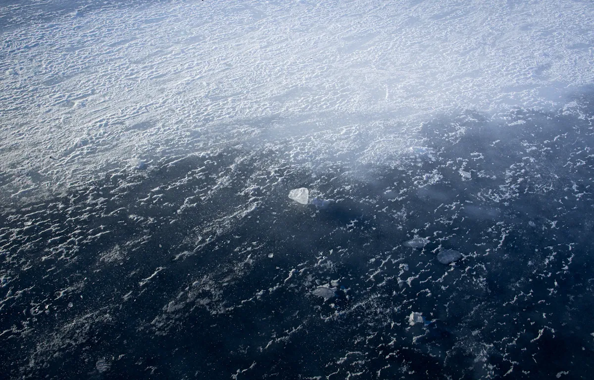 Frozen Arctic Ocean landscape with a satellite radar station amid ice, highlighting militarization of the polar region.