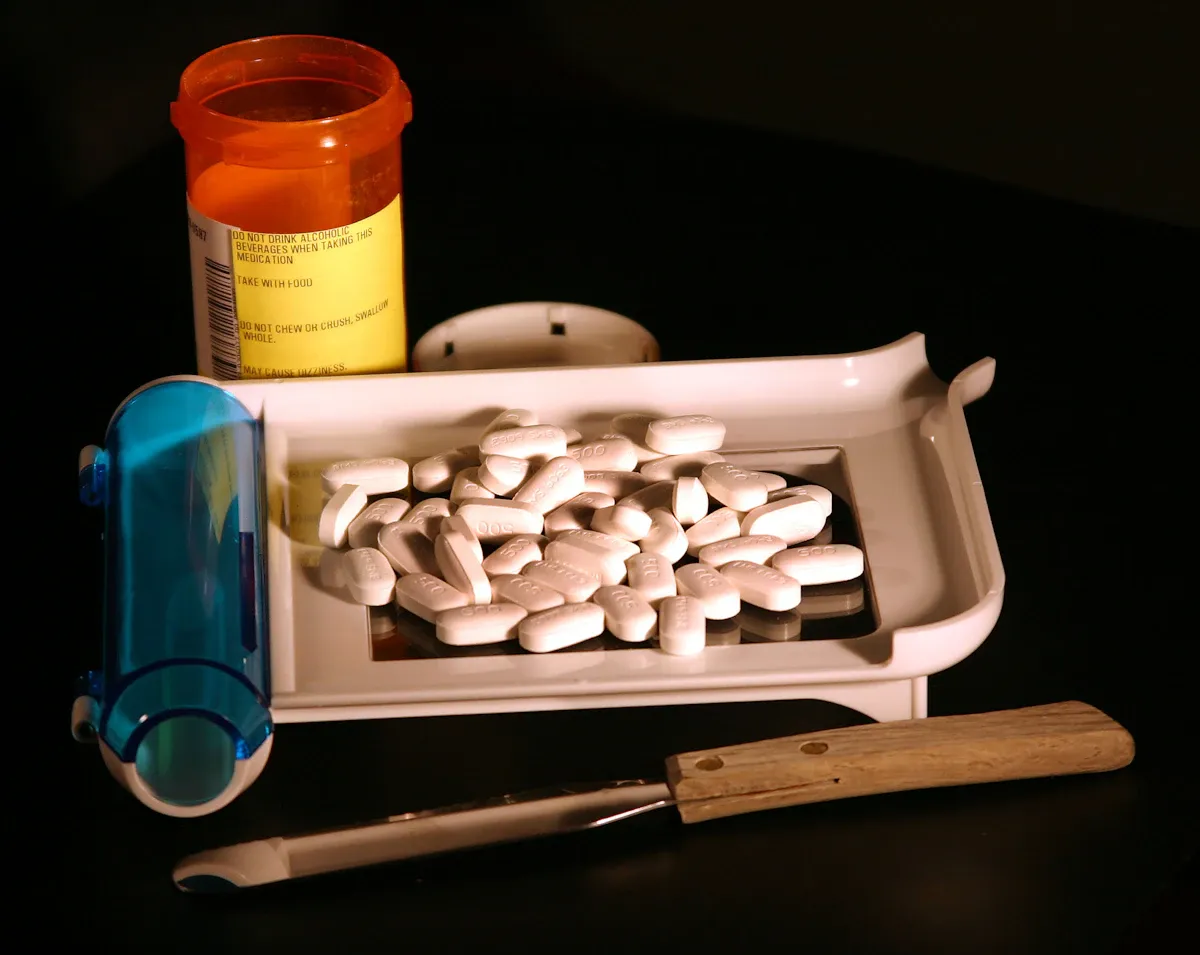 Weight loss medication pills arranged near medical laboratory research equipment in a clean clinical setting