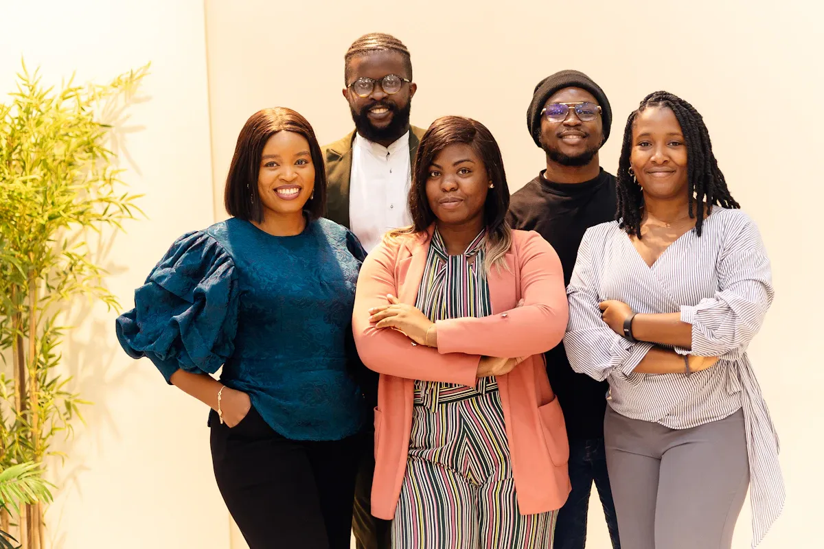 Diverse team working together in a quiet, focused office workspace with natural light.