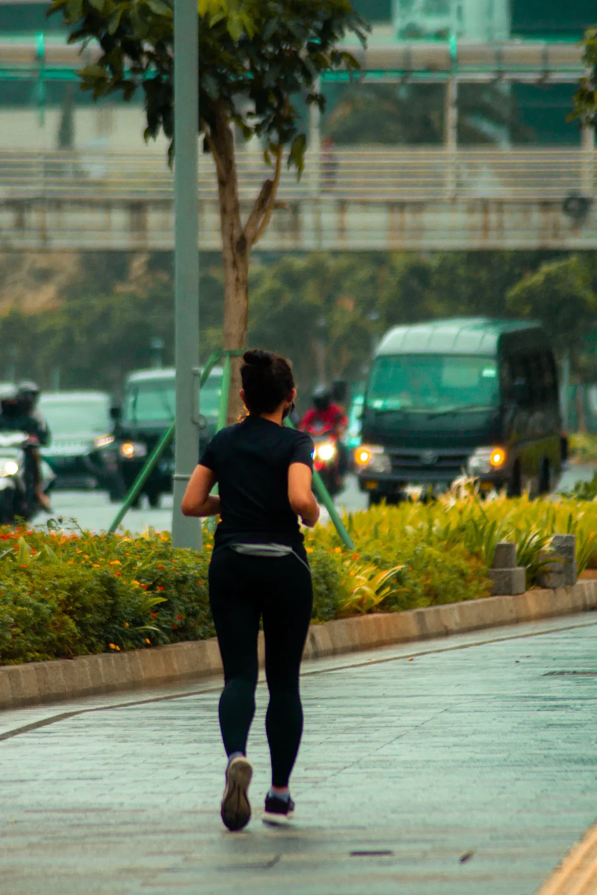 Runner sprinting on a scenic outdoor trail during an intense vigorous exercise and cardio workout session.